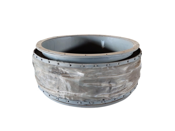 Non-metallic fabric compensator